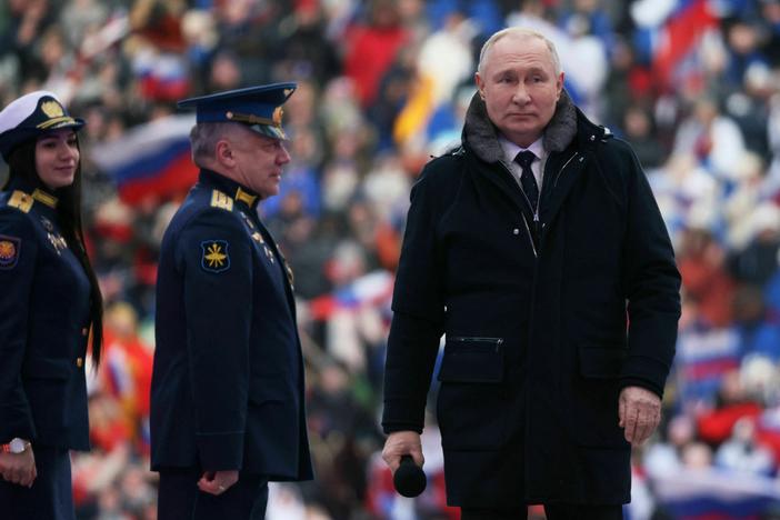 Russian President Vladimir Putin attends a patriotic concert at Luzhniki Stadium in Moscow on Wednesday.