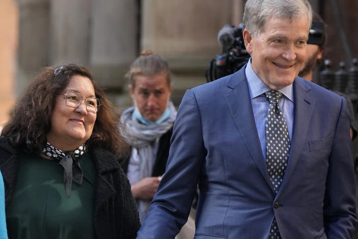 Steve Johnson, right, and his wife Rosemarie arrive at the Supreme Court in Sydney, Australia, on May 2, 2022, for a sentencing hearing in the murder of Scott Johnson, Steve's brother.