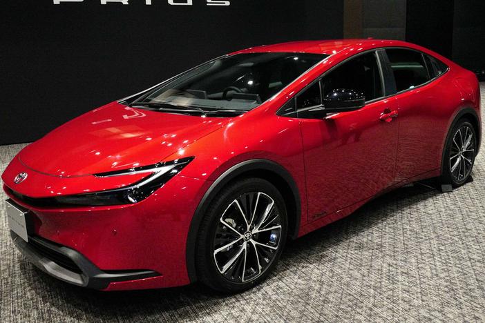Toyota unveils a new Prius in Tokyo on Nov. 16, 2022. A quarter century after Toyota introduced the Toyota Prius, hybrids remain popular with shoppers.