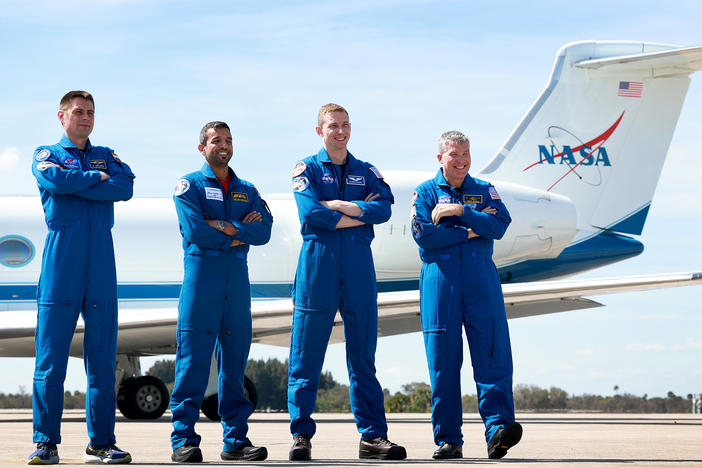 Members of Crew-6 — (L-R) Russian cosmonaut Andrey Fedyaev, Sultan Al-Neyadi of the United Arab Emirates, and NASA astronauts Warren Hoburg and Stephen Bowen — pose after arriving at Florida's Kennedy Space Center on February 21, 2023 in Florida. Each of their flight suits has numerous patches - including one designed specifically for this mission to the International Space Station.