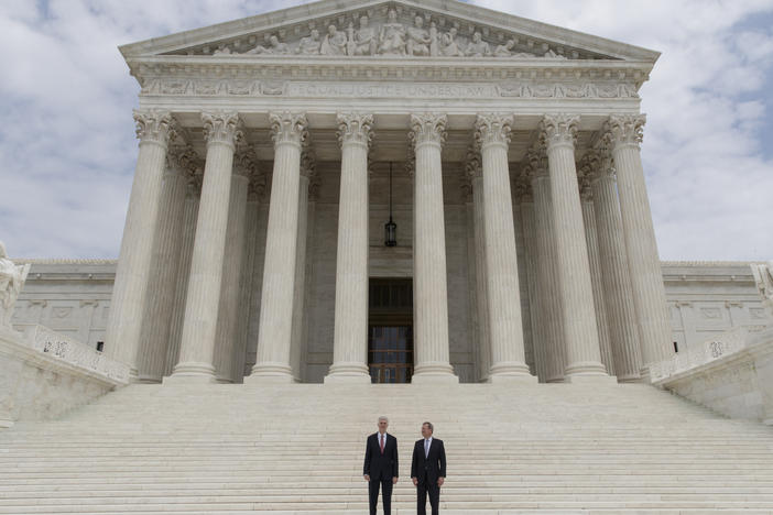 U.S. Supreme Court Justice Neil Gorsuch (left) stands next to Chief Justice John Roberts outside the court in 2017.
