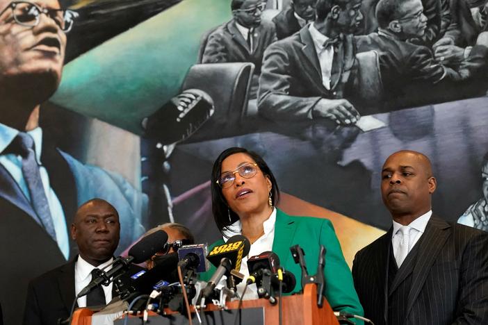 Ilyasah Shabazz (C), daughter of African-American activist Malcolm X, speaks alongside civil rights attorney Ben Crump (L) and co-counsel Ray Hamlin (R) during a press conference in New York on February 21, at the Malcolm X & Dr. Betty Shabazz Memorial and Educational Center, formerly known as the Audubon Ballroom, where Malcolm X was shot dead at 39 on Feb. 21, 1965.