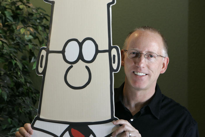 Scott Adams, creator of the comic strip <em>Dilbert</em>, poses for a portrait with the Dilbert character in his studio in Dublin, Calif., in 2006. Several prominent media publishers across the U.S. are dropping the comic strip after Adams described people who are Black as members of "a racist hate group" during an online video show.