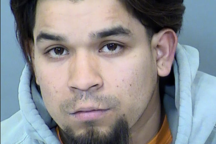 This Sunday booking photo provided by the Goodyear Police Department shows suspect Pedro Quintana-Lujan, 26. He was arrested in connection with a crash that killed two bicyclists and injured 11 others in Goodyear, a Phoenix suburb, authorities said Sunday.