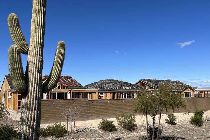 New homes under construction in the desert west of Phoenix.