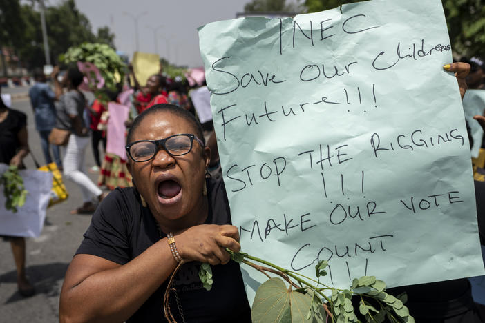 Demonstrators accusing the election commission of irregularities and disenfranchising voters make a protest in downtown Abuja, Nigeria.