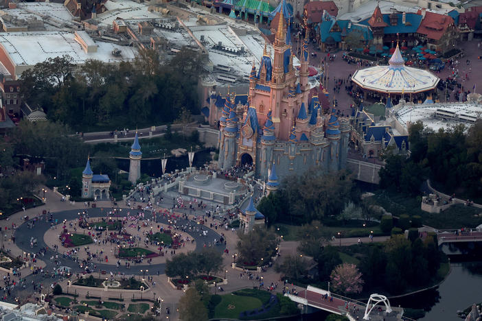 In an aerial view, Walt Disney World's iconic Cinderella Castle is seen on the grounds of the theme park this February. On Monday, Florida Gov. Ron DeSantis took control of Disney's special tax district.