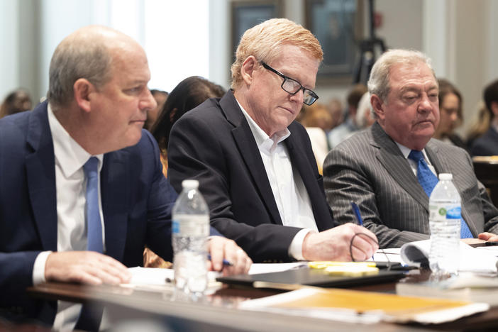 The legal team for Alex Murdaugh (center) presented their closing argument in his double murder trial on Thursday. He's seen here listening to prosecutor Creighton Waters make his closing arguments at the Colleton County Courthouse in Walterboro, S.C.
