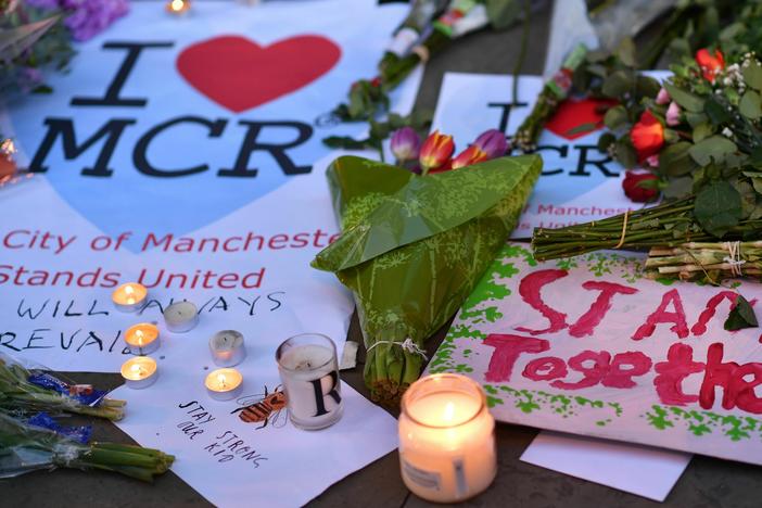 Messages and floral tributes are seen in Albert Square in Manchester, northwest England on May 23, 2017, in solidarity with those killed and injured in the May 22 terror attack at the Ariana Grande concert at the Manchester Arena. Twenty two people were killed and dozens injured in Britain's deadliest terror attack in over a decade, which officials now say could have been prevented.