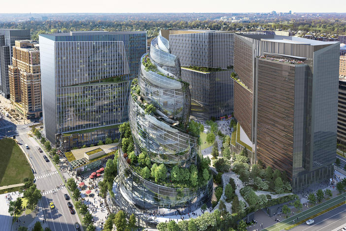 This artist rendering provided by Amazon shows the next phase of the company's headquarters redevelopment to be built in Arlington, Va. Amazon is pausing construction of its second headquarters there following the biggest round of layoffs in the company's history and the shifting landscape of remote work.