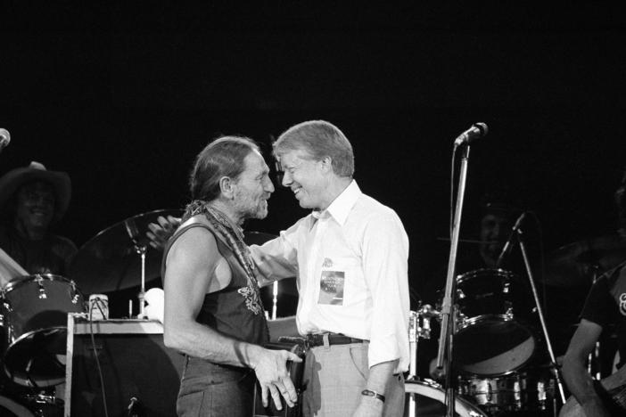 July 21, 1978: President Jimmy Carter greets Willie Nelson, left, after watching the star country and western music singer perform in a concert at the Merriweather Post Pavillion at Columbia, Md.