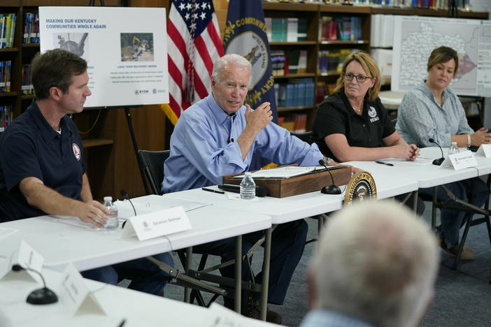 President Biden gets a briefing in Lost Creek, Ky., after touring flood damage. He vowed that communities in the state would get help to rebuild after the disaster.