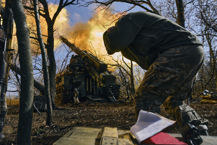 Ukrainian soldiers fire a self-propelled howitzer towards Russian positions near Bakhmut, Donetsk region, Ukraine, Sunday.