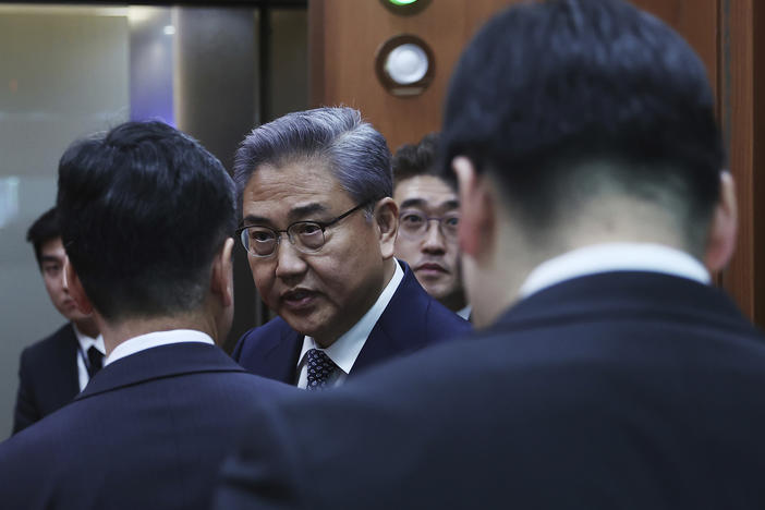 South Korean Foreign Minister Park Jin, center, leaves after a briefing announcing a plan on Monday to resolve a dispute over compensating people forced to work under Japan's 1910-1945 occupation of Korea, at the Foreign Ministry in Seoul, South Korea Monday, March 6, 2023.