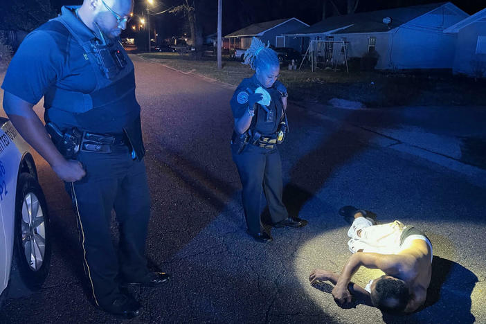 Jackson Police Department Capt. Julian Lonie and Officer Courtney Williams respond to a call about a man found "laid out" on a street. Officers called an ambulance for the man.