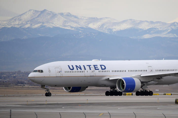 A United Airlines jetliner taxis to a runway for take off from Denver International Airport, Dec. 27, 2022.