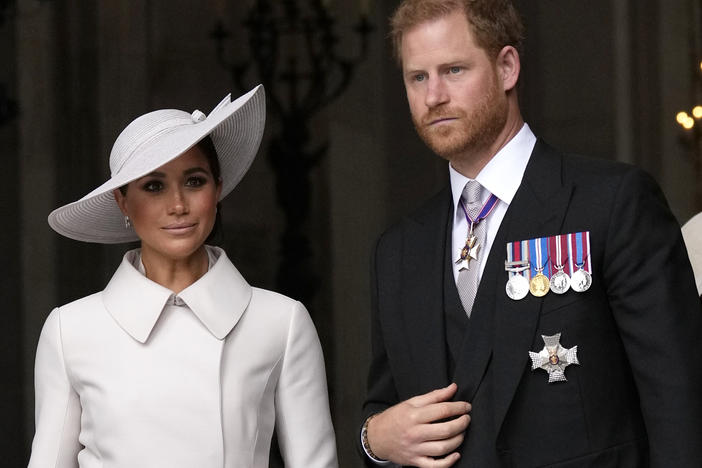 Prince Harry and Meghan Markle, Duke and Duchess of Sussex, leave after a service of thanksgiving for the reign of Queen Elizabeth II at St Paul's Cathedral in London on June 3, 2022.