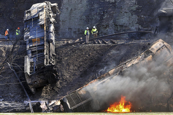 Smoke fills the sky after an empty CSX coal train hit a rockslide along tracks causing a fiery derailment, Wednesday, March 8, 2023, in a remote area just south of Sandstone, W.Va.