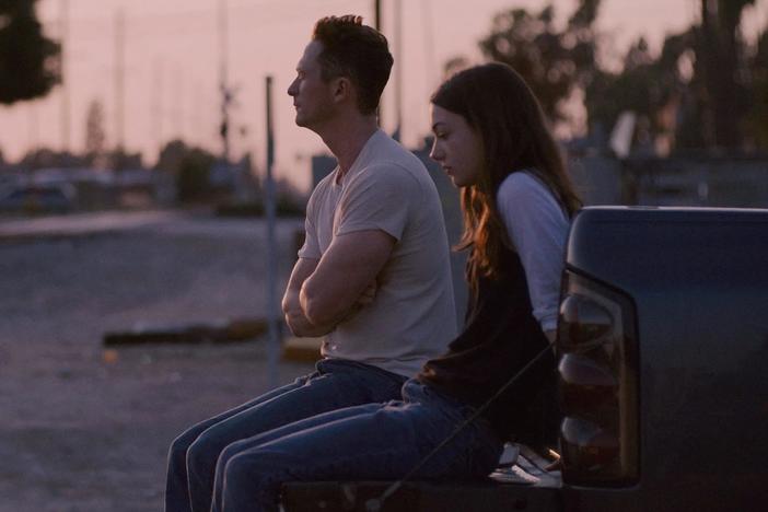 Tom (Jonathan Tucker) cultivates a sense of dependency in 17-year-old Lea (Lily McInerny) in <em>Palm Trees and Power Lines.</em>