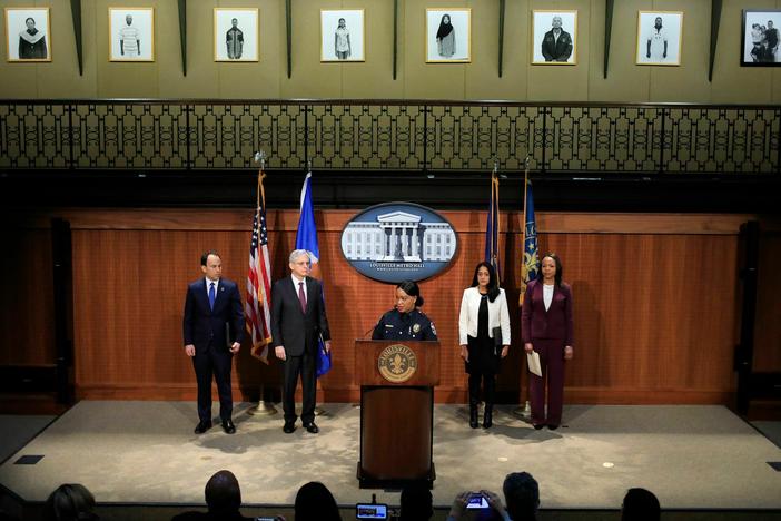 Louisville Metro Police Department Interim Chief Jacquelyn Gwinn-Villaroel, along with other city and federal officials, discuss the civil rights investigation at a press conference on Wednesday. Louisville Mayor Craig Greenberg (L) and U.S. Attorney General Merrick Garland (R) are standing to her left.