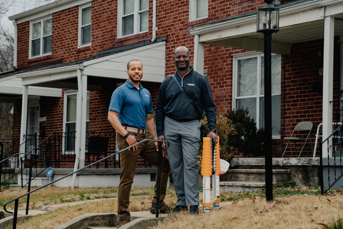 Real estate appraiser Jack Sonceau (right) and his trainee, Devin Minnis, assess a rowhome in Baltimore.