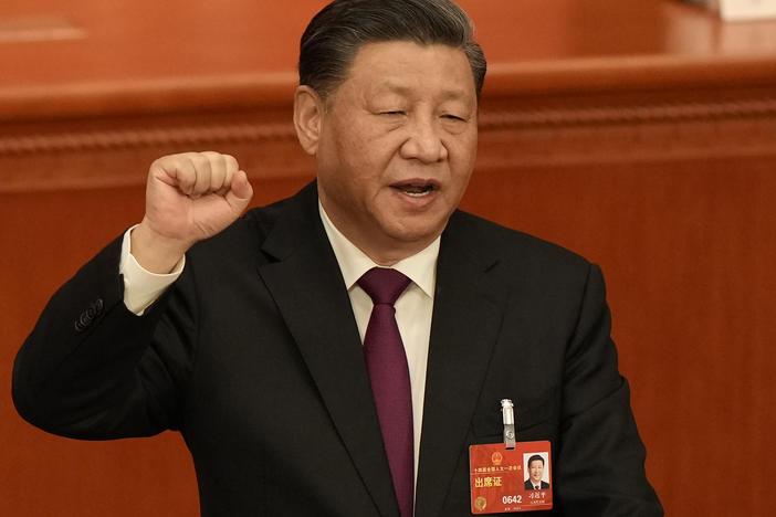 Chinese President Xi Jinping takes his oath after he is unanimously elected as President during a session of China's National People's Congress (NPC) at the Great Hall of the People in Beijing, Friday, March 10, 2023.