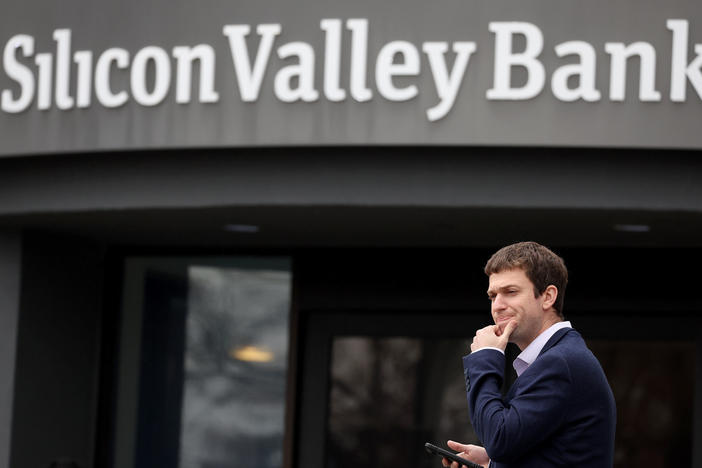 A customer stands outside of the shuttered Silicon Valley Bank headquarters in Santa Clara, Calif., on March 10, 2023. The lender was taken over federal regulators on Friday, marking one of the largest bank failures since the 2008 Global Financial Crisis.