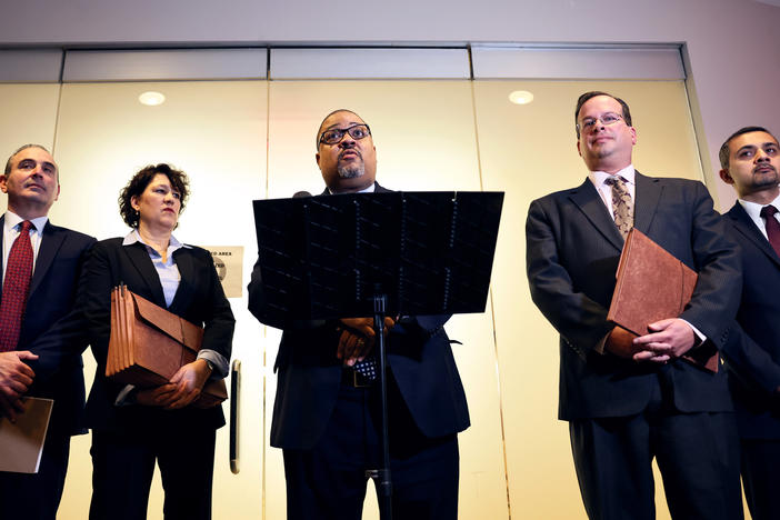 Manhattan District Attorney Alvin Bragg speaks at a press conference in January, after a sentencing hearing of the Trump Organization. Bragg's office has invited former President Trump to testify before a grand jury — a step that often precedes an indictment.