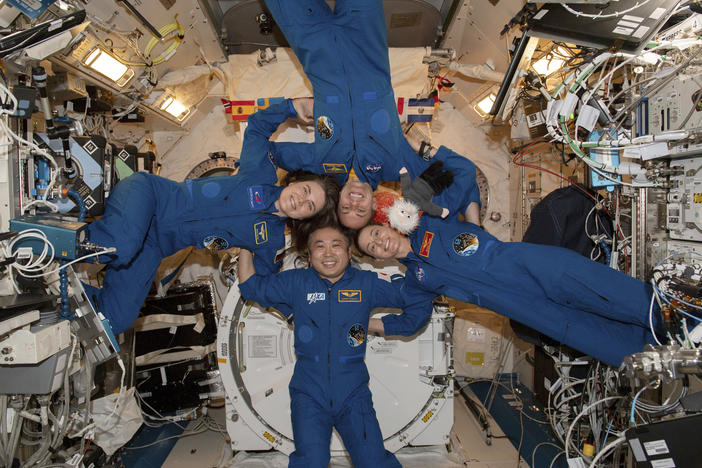 Expedition 68 Flight Engineers, pictured clockwise from left, Anna Kikina of Roscosmos, Josh Cassada and Nicole Mann from NASA, and Koichi Wakata of JAXA (Japan Aerospace Exploration Agency) gather for a portrait inside the International Space Station's Kibo laboratory module on March 1.