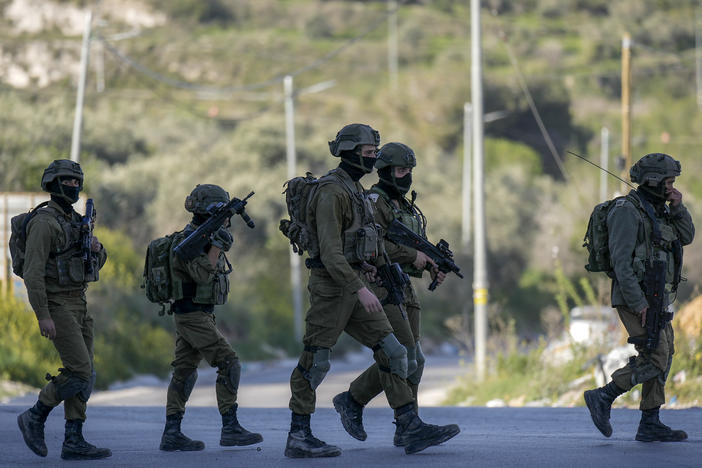 Israeli soldiers operate in village of Sarra near the Palestinians West Bank city of Nablus, Sunday, March 12, 2023. Israeli forces fatally shot three Palestinian gunmen who opened fire on troops in the occupied West Bank. It was the latest bloodshed in a year-long wave of violence in the region.