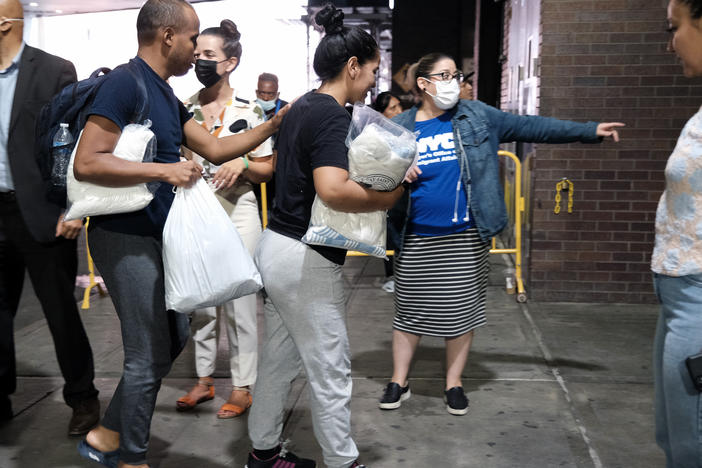 Migrants are directed through Manhattan's Port Authority bus station last August.