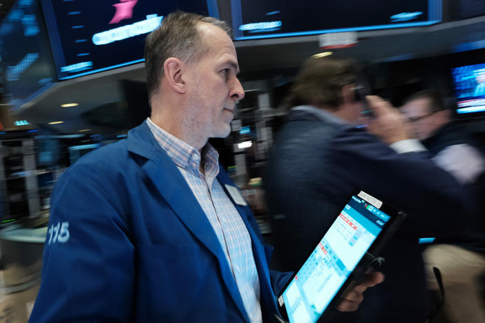 Traders work on the floor during morning trading at the New York Stock Exchange (NYSE) in New York City on March 10, 2023. Bank shares slumped on Monday despite U.S. regulator action to protect deposits at Silicon Valley Bank and Signature Bank.