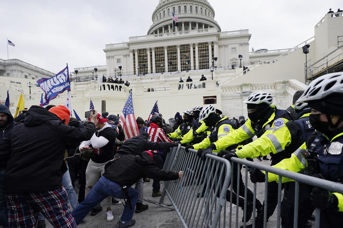 Insurrectionists loyal to President Donald Trump try to break through a police barrier on Jan. 6, 2021, at the Capitol in Washington, D.C.