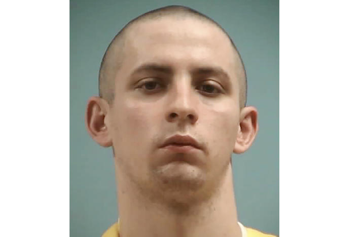 This image provided by the Mississippi Department of Corrections shows Axel Cox, 24, of Gulfport, Miss. Cox, who burned a cross in his front yard to intimidate his Black neighbors in December 2020, was sentenced Thursday, March 9, 2023, to 42 months in prison.