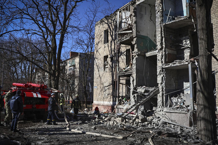 Ukrainian Emergency Service rescuers work on a building damaged by shelling in Kramatorsk, Ukraine, on Tuesday. The attack happened hours before a Russian fighter jet collided with a U.S. drone over the Black Sea.