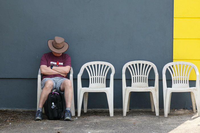 A spectator sleeps during IRONMAN Ireland on Aug. 14, 2022, in Cork, Ireland.