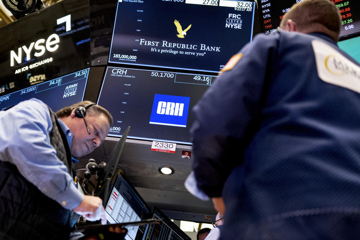 Traders work on the floor at the New York Stock Exchange in New York on March 13.