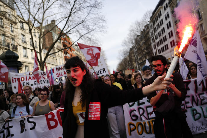 Students shout slogans during a demonstration against the government's plan to raise the retirement age to 64 in Paris on Thursday. French President Emmanuel Macron has shunned parliament and opted to push through a highly unpopular bill that would raise the retirement age from 62 to 64 by triggering a special constitutional power.