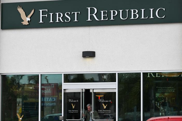 A customer exits a First Republic Bank branch in Manhattan Beach, Calif., on March 13, 2023. The midsized lender was rescued by a group of top banks after suffering an exodus of depositors following the collapse of two U.S. banks.