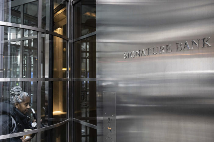 A person enters the Signature Bank headquarters in New York on March 13.