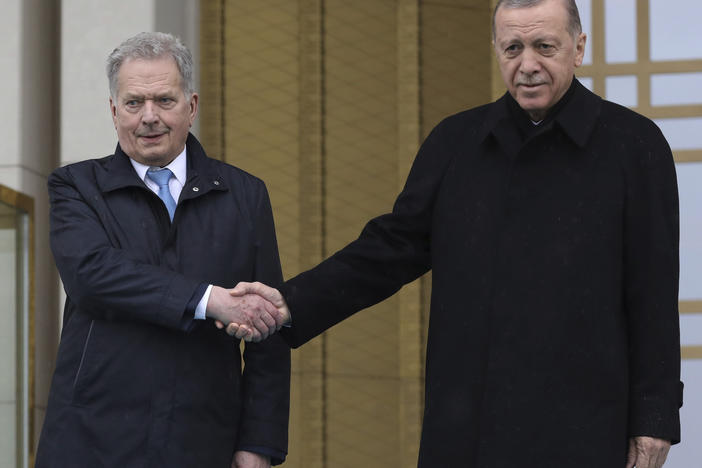 Turkish President Recep Tayyip Erdogan, right, and Finland's President Sauli Niinisto shake hands during a welcome ceremony at the presidential palace in Ankara, Turkey, on Friday.