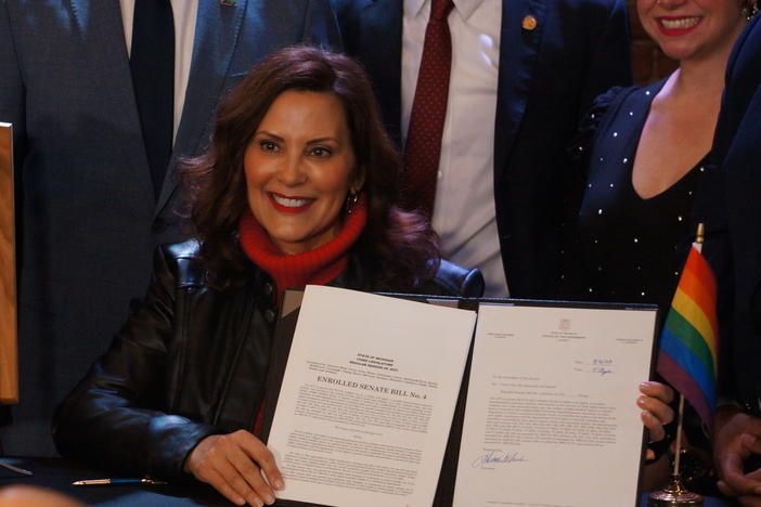 Michigan Gov. Gretchen Whitmer signs a law to include the rights of LGBTQ people in Michigan's Civil Rights law on Thursday, March 16, 2023, in Lansing, Mich.