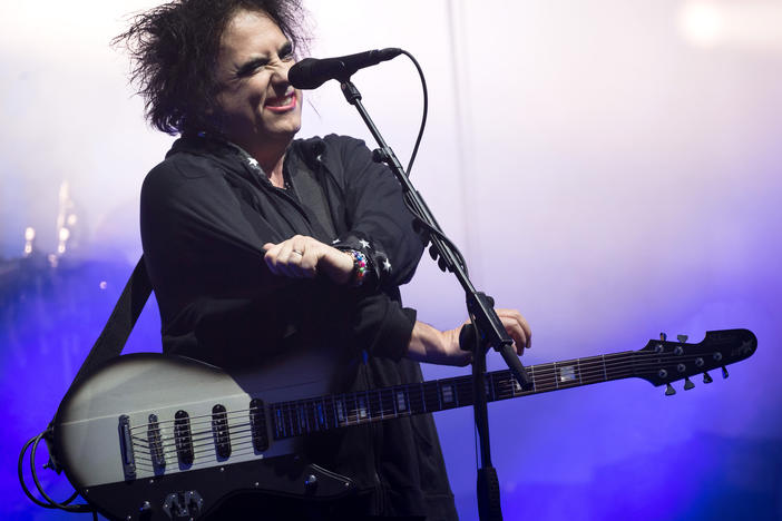 Robert Smith of The Cure performs in Glastonbury, England, in 2019. This week, he shared his frustrations with Ticketmaster, and announced Thursday that the company would lower fees and offer partial refunds to The Cure's ticket purchasers.