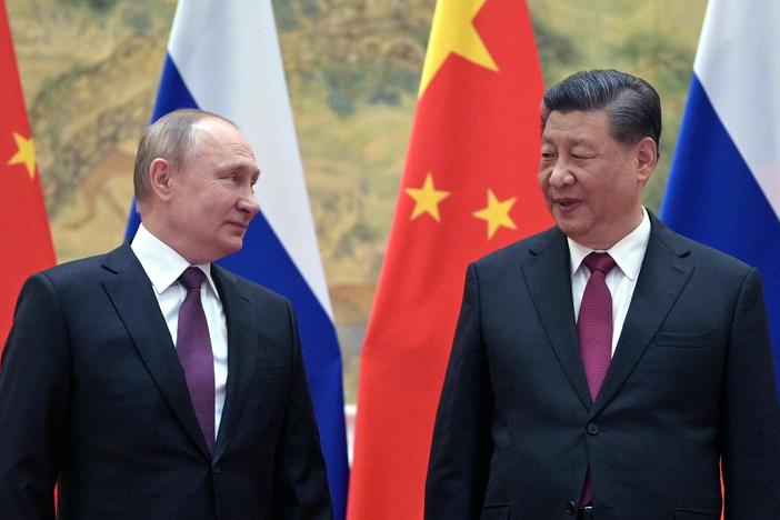 Russian President Vladimir Putin and Chinese President Xi Jinping pose for a photograph during their meeting in Beijing, on Feb. 4, 2022