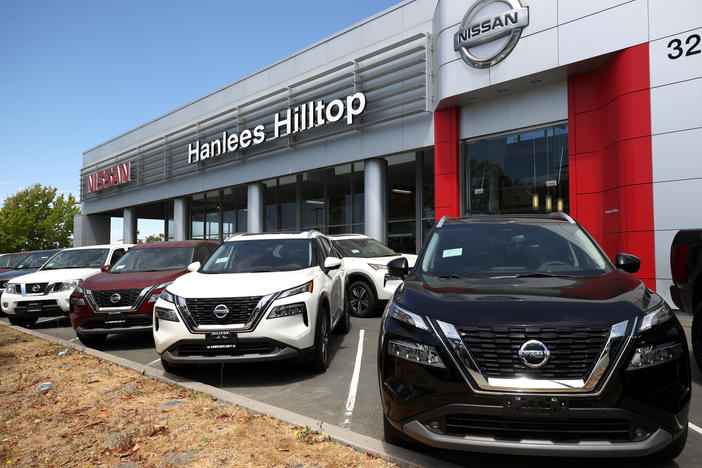 Brand-new Nissan vehicles sit on a sales lot in Richmond, Calif., on July 9, 2021. Car prices surged during the pandemic, and despite coming down from their peak, they still remain higher than a few years ago.