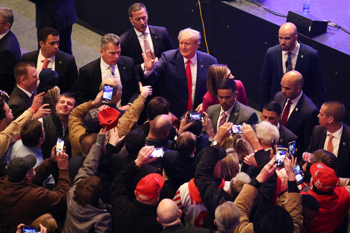 Former President Donald Trump greets guests following an event on March 13, 2023 in Davenport, Iowa. Trump's visit followed those by potential challengers for the GOP presidential nomination, Florida Gov. Ron DeSantis and former U.N. Ambassador Nikki Haley.