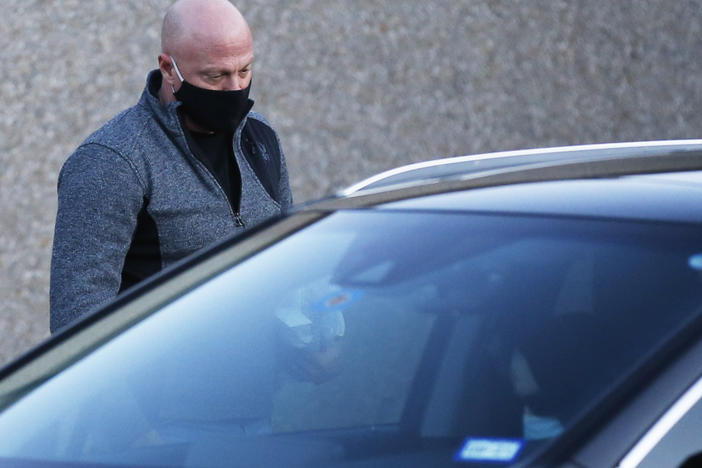 Retired Air Force officer Larry Rendall Brock Jr. walks out of Parker County Jail upon release on Jan. 14, 2021, in Weatherford, Texas.