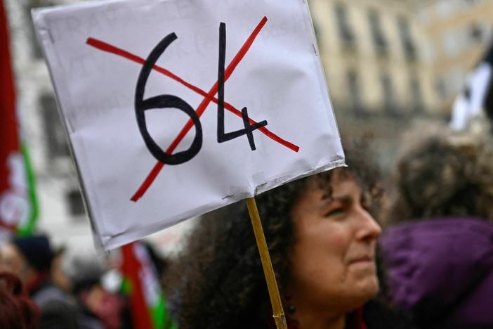 A protester participates in a demonstration in Marseille on March 18 after the French government pushed a pensions reform through parliament without a vote.