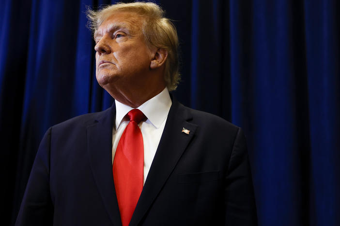Former President Donald Trump speaks to reporters before his speech at the annual Conservative Political Action Conference (CPAC) at Gaylord National Resort & Convention Center on March 4 in National Harbor, Md.