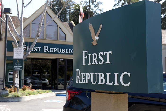 The First Republic Bank sign is shown in Oakland, Calif., in front of one of the lender's offices on March 16, 2023. First Republic shares continued to fall on Monday amid concerns about its financial health.